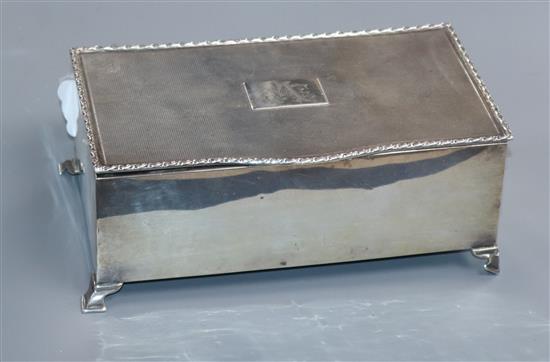A 1930s silver cigarette box, with engine turned lid, 17.3cm.